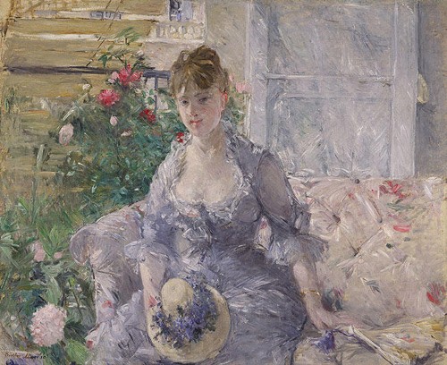 Mujer joven sentada en el sofá de Morisot